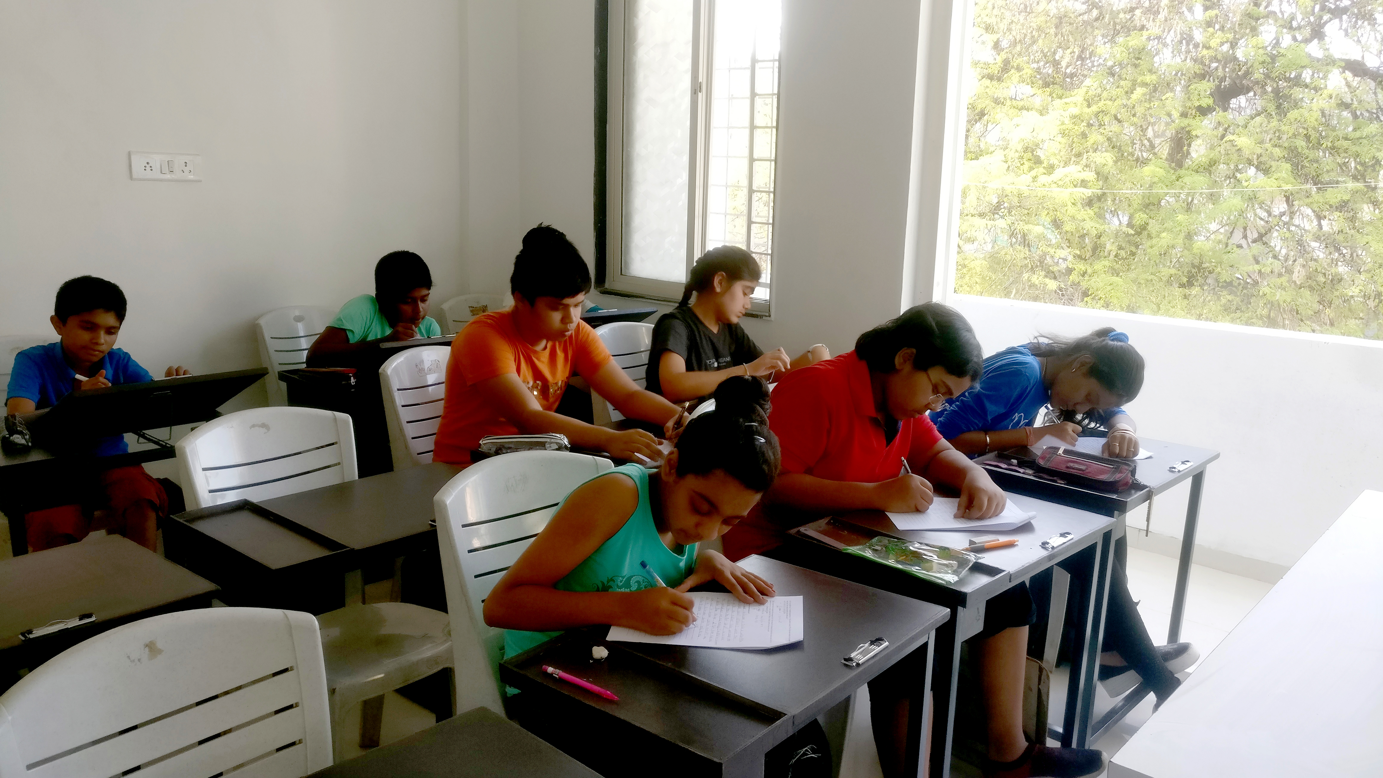 Live studio drawing demonstration with students observing